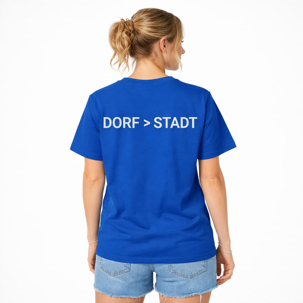 Oversized blaues T-Shirt "Dorf>Stadt" für Damen und Herren - Streetwear-Style.