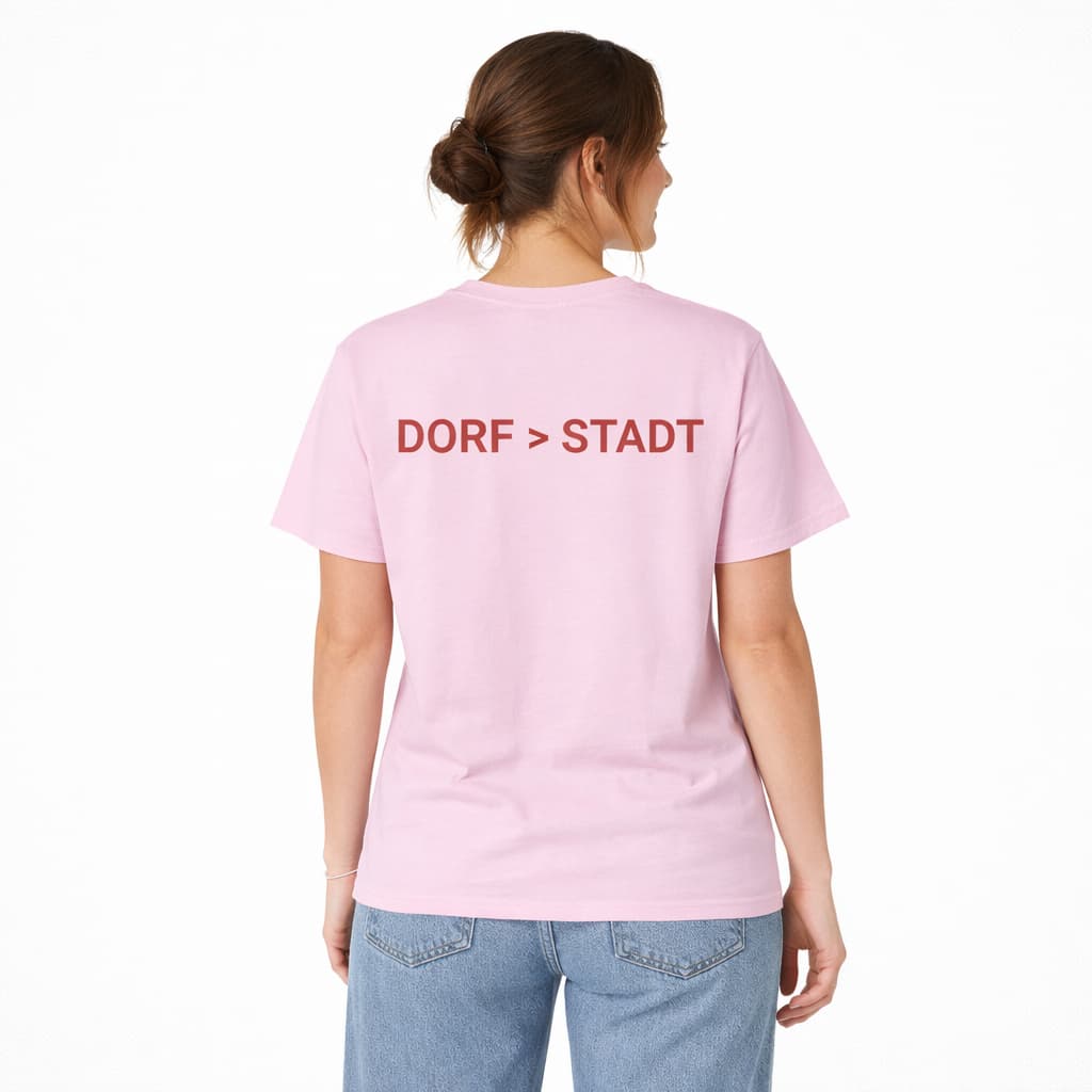 Oversized rosa T-Shirt "Dorf>Stadt" für Damen und Herren - Streetwear-Style.